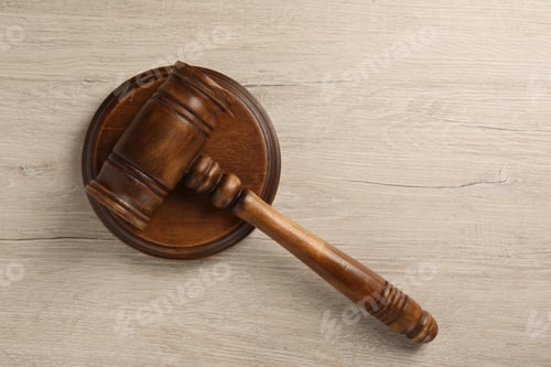 Preview: Wooden gavel on light table, top view