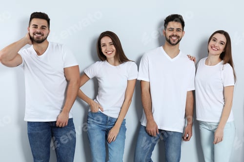 Preview: Group of young people in stylish jeans on light background