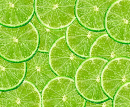 Preview: Limes with slices close up background