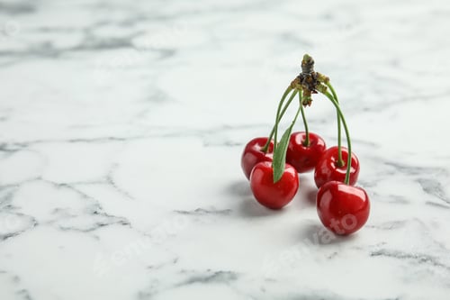 Preview: Sweet red cherries on marble table