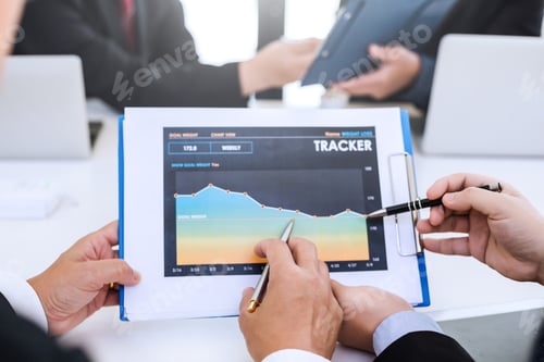 Preview: Businessman present graph financial information at the meeting.