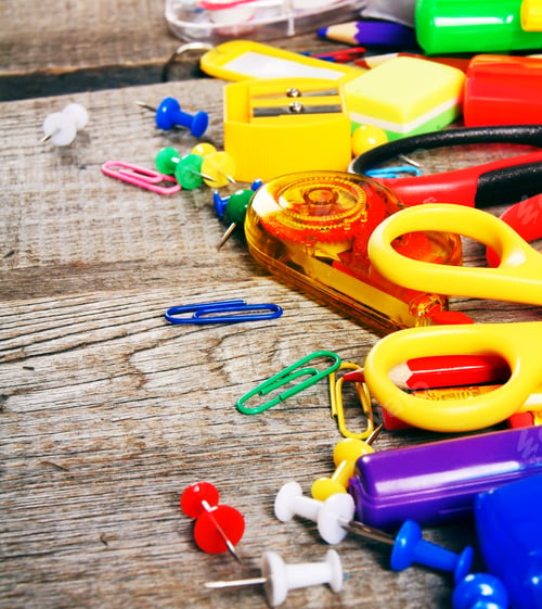 Preview: School tools. On wooden background.