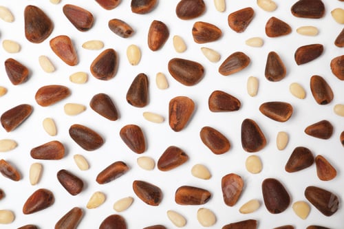 Preview: Flat lay composition with pine nuts on white background