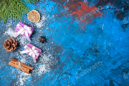 Preview: top view xmas gifts fir tree branches cones anises on blue background free place