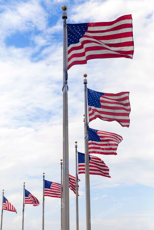 Preview: American flags waving in the wind in the blue sky, Washington DC.