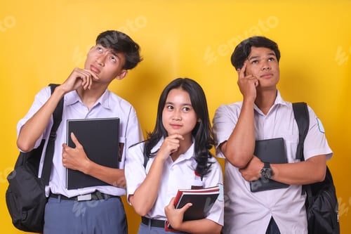 Preview: Thoughtful Asian Students Holding Books