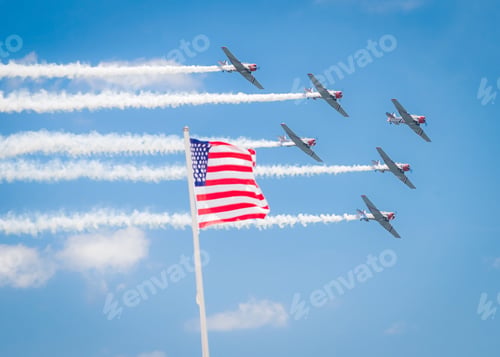 Preview: Planes flying by American flag on Memorial Day . Air show