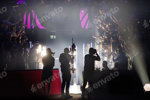 Preview: cameraman silhouette filming during event