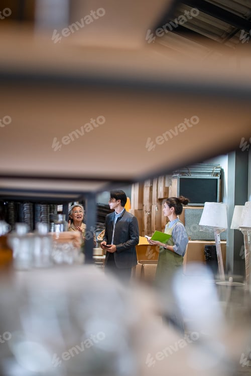 Preview: Mother, son and daughter are working at their DIY store.