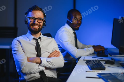 Preview: Male technical support agent trying to explain something to a client while using hands free