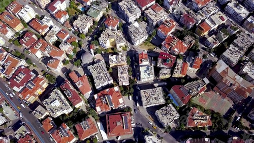Preview: Top view of high-rise buildings with red roofs. Clip. Beautiful houses with red roofs are located