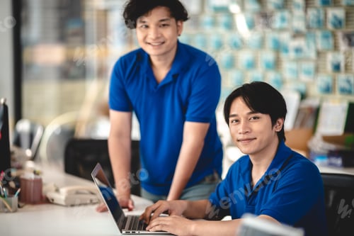 Preview: Efficient Business Transactions: Asian Man and Female Salesperson Manage Payment and Bill