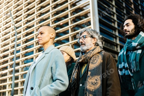 Preview: Professional business people standing together outdoors in financial district.