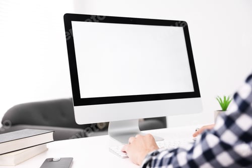 Preview: Man working on computer at white desk in office, closeup. Mockup for design