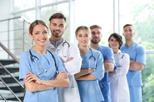 Preview: Team of doctors in uniform at workplace