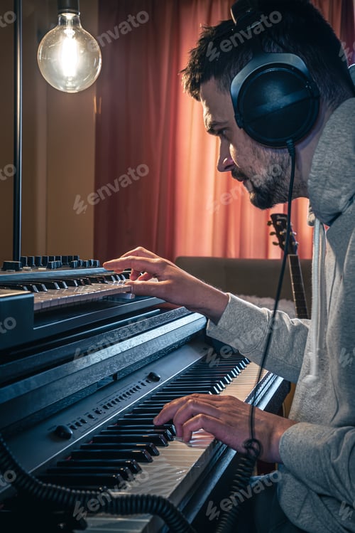 Preview: Man Playing Keyboard at Home Studio