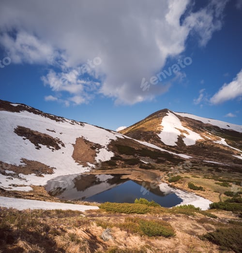 Preview: Beautiful lake in the mountains in spring