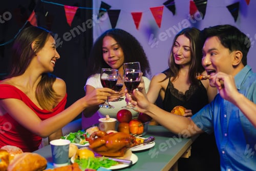 Preview: Dinner and group celebrating New Year's Eve Friends enjoy and celebrate w
