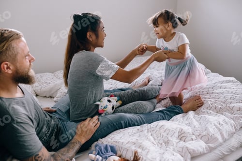 Preview: Family having fun in the bedroom