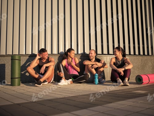 Preview: Young mixed race sportive people after workout