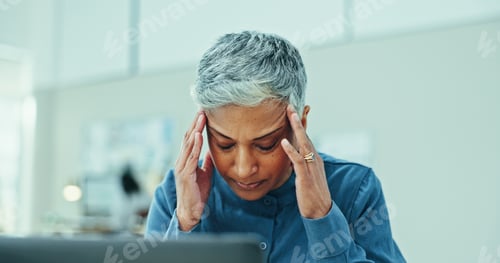 Preview: Mature, frustrated woman or stress with headache for pressure, deadline or overworked at office. Se