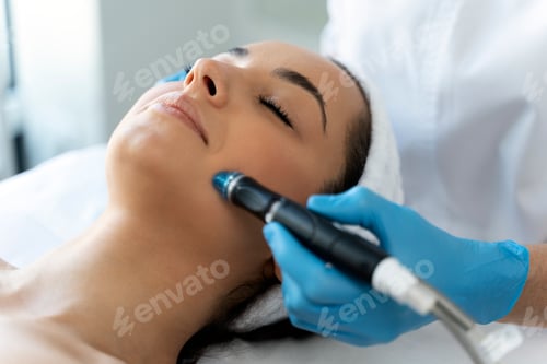 Preview: Close-up of woman getting facial hydro microdermabrasion peeling treatment