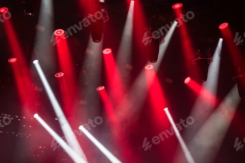 Preview: Bright red and white stage lights during a live concert