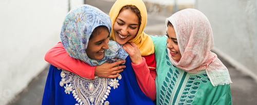 Preview: Happy Muslim women walking in the city center