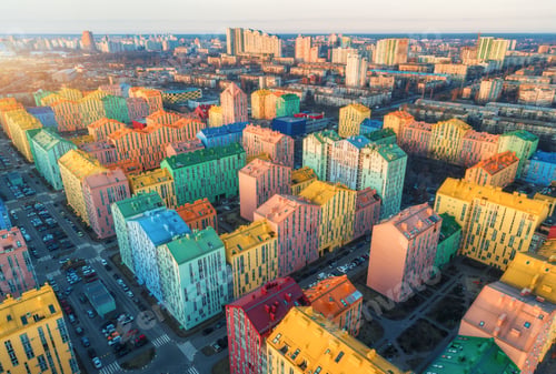 Preview: Aerial view of the colorful buildings in european city at sunset