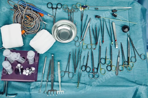 Preview: Surgical instruments in the operating room, laid out on a sterile table on a special blue tissue