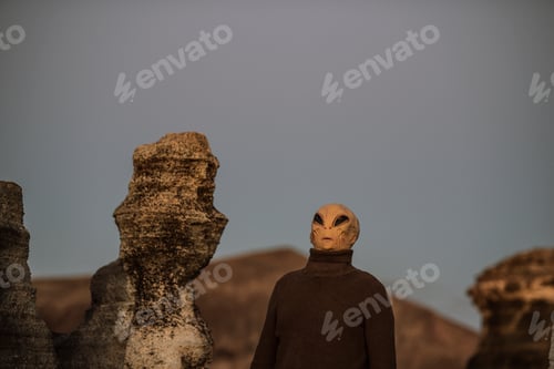 Preview: Alien ufo portrait with moon landscape in background. Standing extraterrestrial people