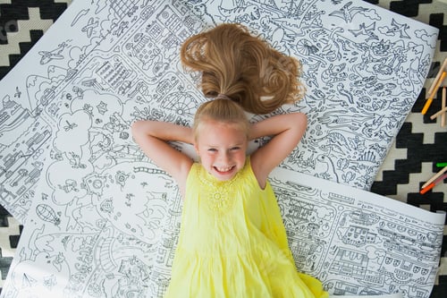 Preview: Happy blonde gen z girl lay on coloring books and smile