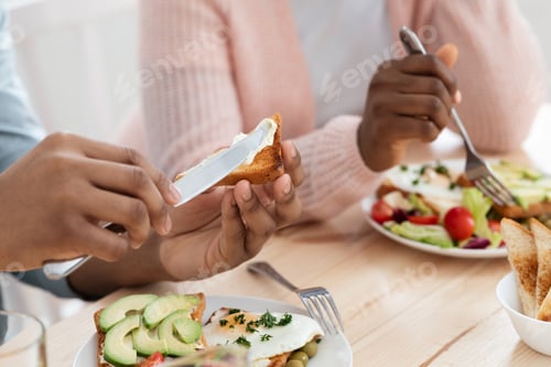Preview: Breakfast Time. Unrecognizable African American Couple Enjoying Tasty Food In Kitchen
