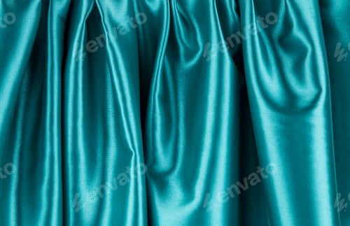 Preview: Soft folds of blue silk cloth texture.