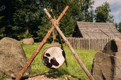 Preview: An old traditional drum with fur hanging in a medieval village