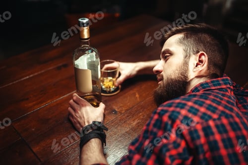 Preview: Drunk man sleeps at the bar counter, top view