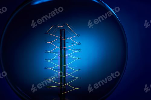 Preview: Electric vintage Edison light bulb with a spiral on a blue background. Retro style lamp