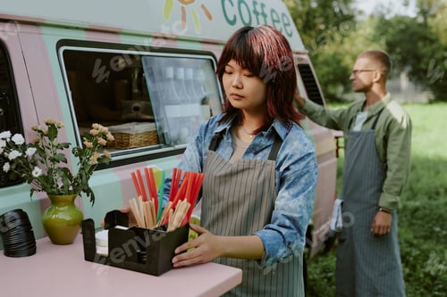 Preview: Asian Female Worker Adjusting g Plastic Box on Table