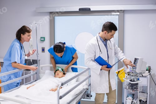 Preview: Doctors examining patient in ward