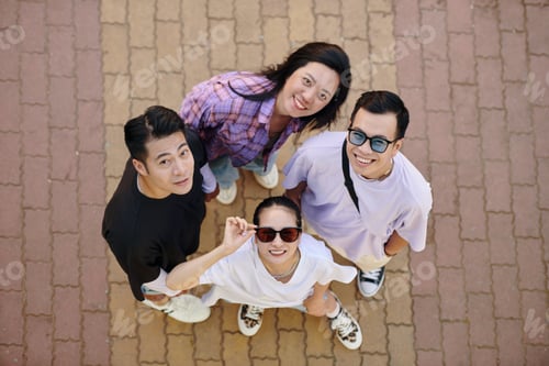 Preview: Looking Up at Smiling Friends in Circle