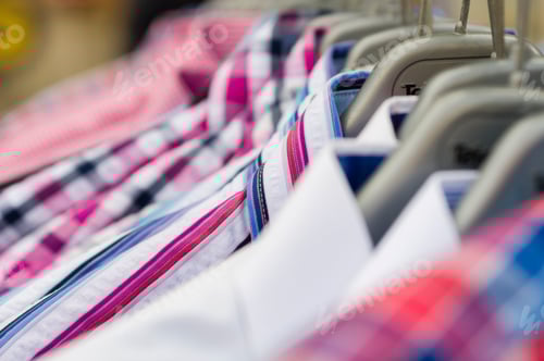 Preview: Variety of Stylish Shirts Displayed on Hangers