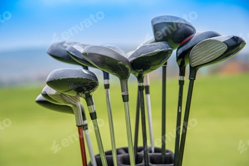 Preview: professional golf clubs in bag on green.