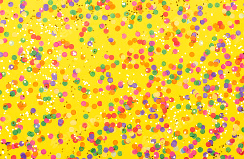 Preview: Colorful mix of confetti on yellow background.