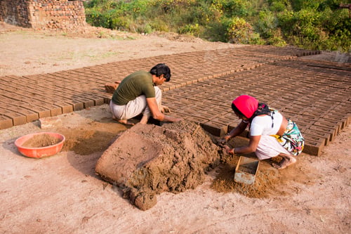 Preview: Indian worker making house bricks