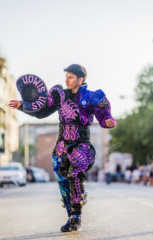Preview: Hispanic man dancing Caporales with san simon costume during hispanicity day parade.