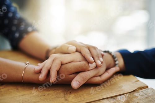 Preview: Closeup shot of two unrecognizable people holding hands in comfort