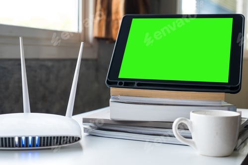 Preview: Tablet and router wireless on the table at home.