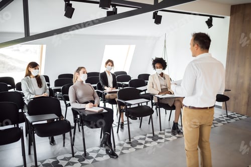 Preview: Diverse group of people during pandemic on a business conference.