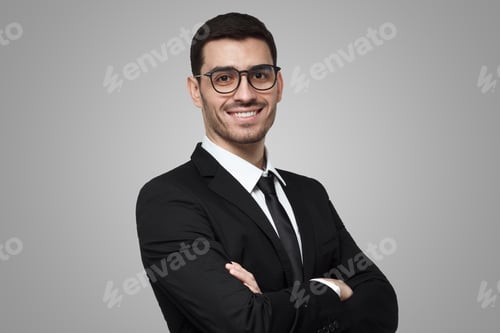 Preview: Positive businessman in black suit, white shirt, tie, glasses with arms crossed, ready to cooperate
