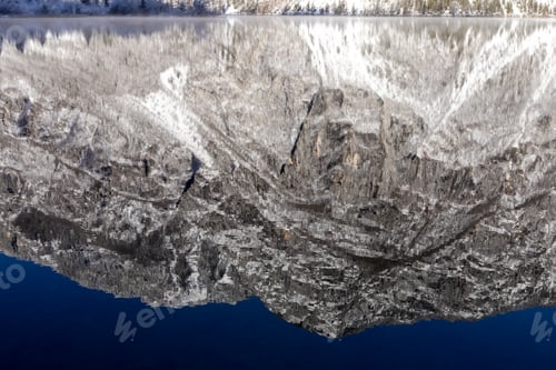 Preview: Reflection of the mountain and sky in winter in Lake Bohinj Slovenia